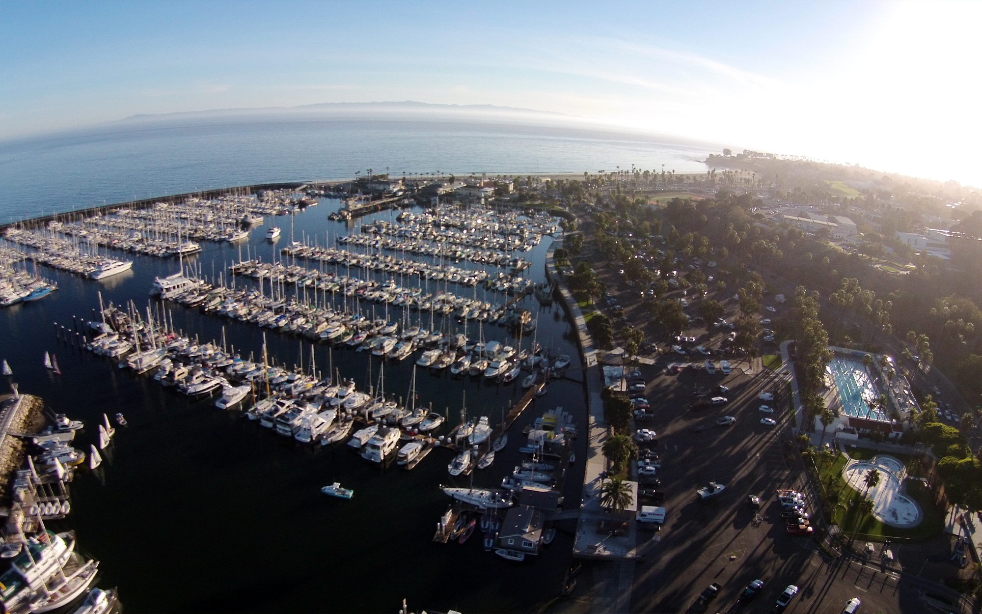 Santa Barbara harbor with boats and sunset